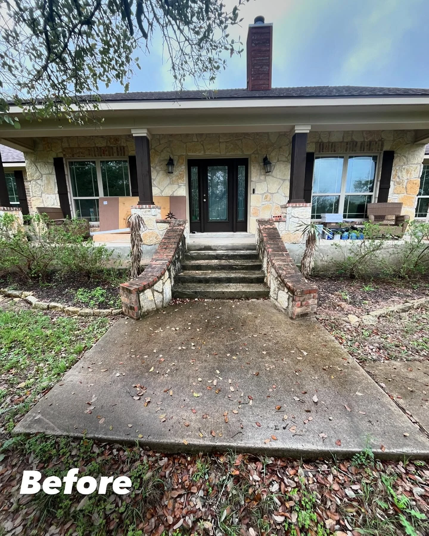 Front steps and concrete entry path before The Clean Home Crew cleaned the home